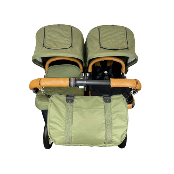 Olive colored Diaper bag attached to a pram